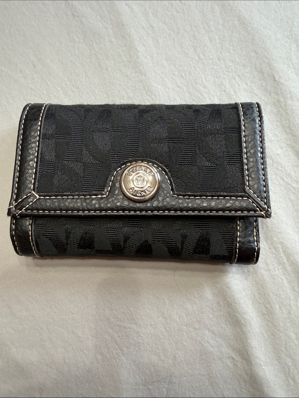 Etienne Aigner Black Signature Trifold Wallet with Silver Logo Button